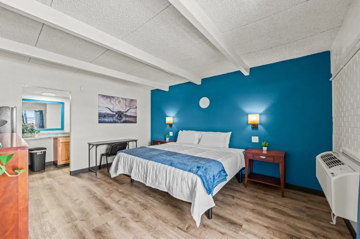 Queen room with desk, nightstand and vanity